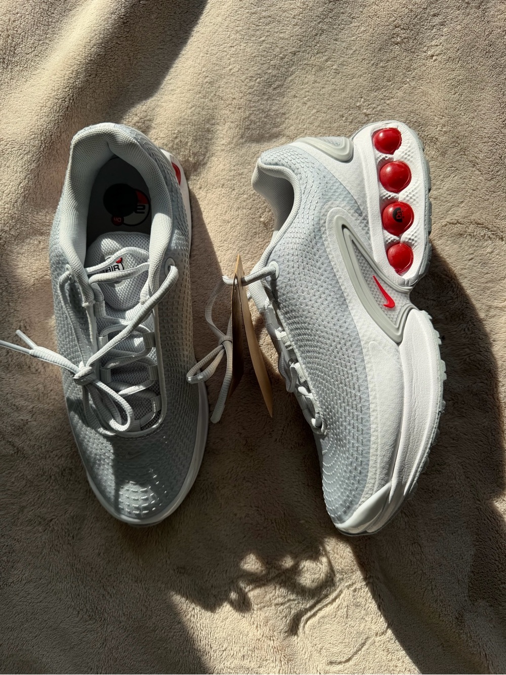 Nike White Athletic Shoes with Red Accents